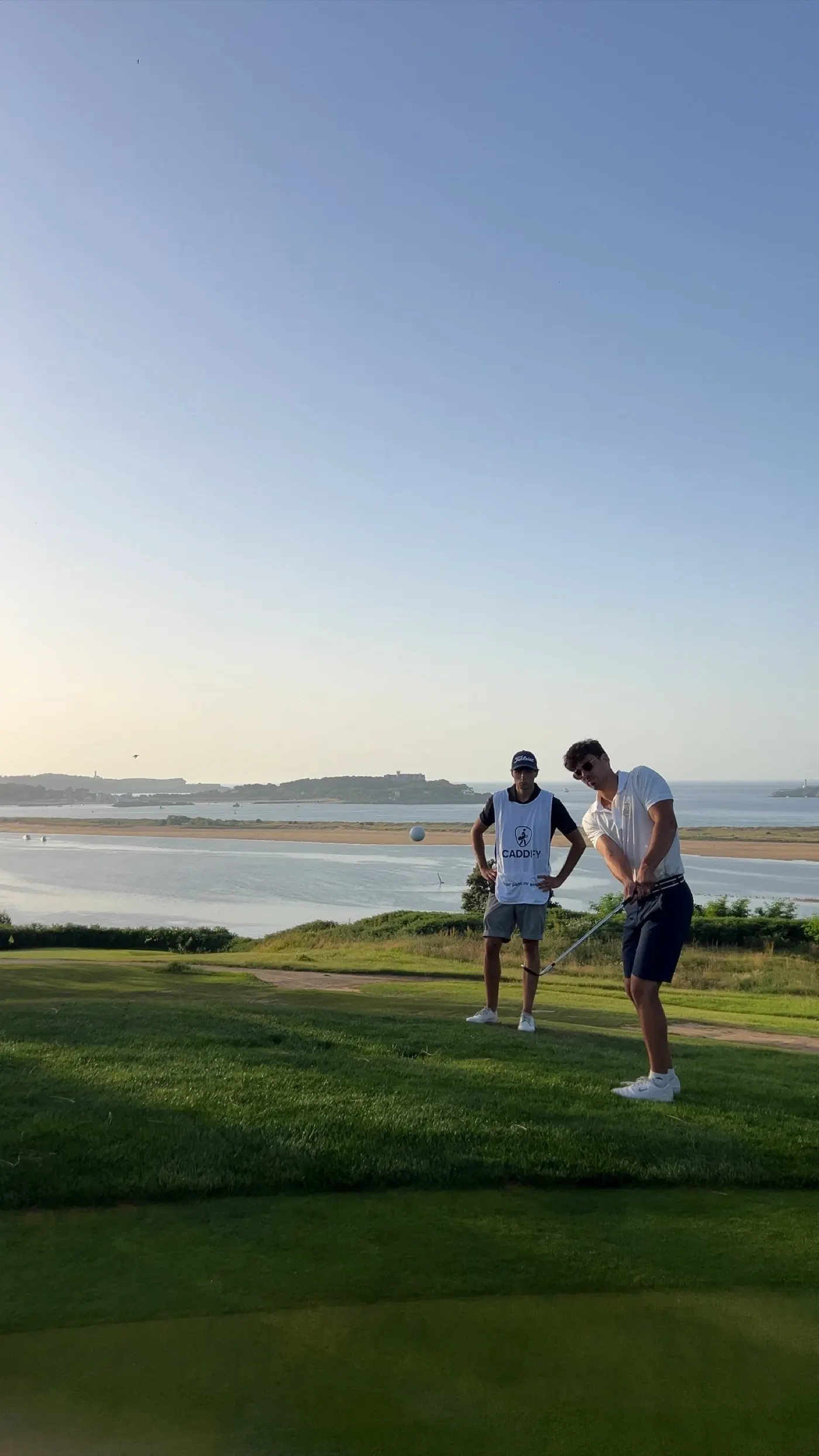 Tee box by the sea on a golf course